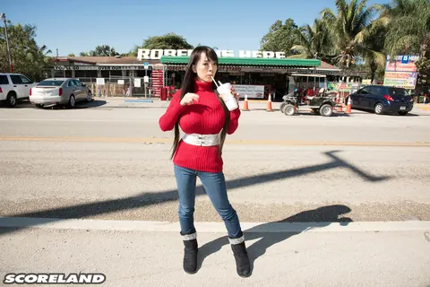 Hitomi Tanaka: Asian Woman Fills Out Her Sweater and Jeans Outdoors – photo 4 of 16