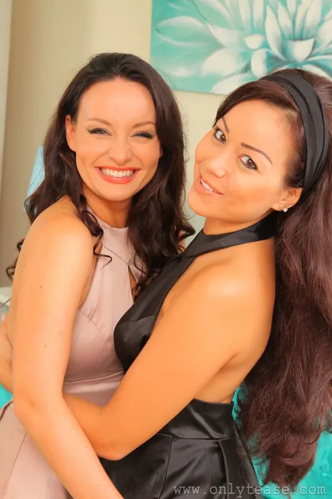 Carla Brown: Two Busty Asian Brunettes Pose in Skirts, Stockings and Boots – photo 1 of 21