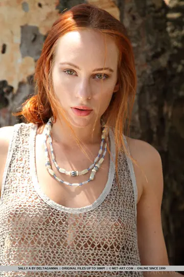 European Redhead Bares Her Hairy Pussy in the Forest