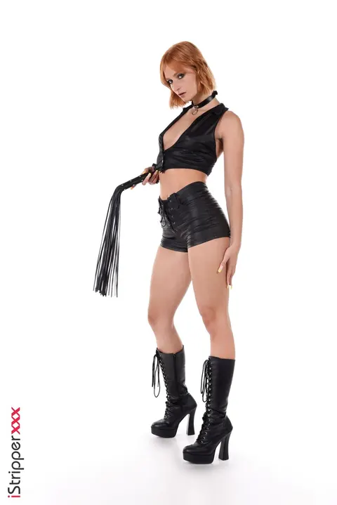 Dolly Dyson: Redhead in Leather Shorts and Boots Stuffs a Dildo – photo 1 of 15