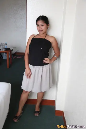 Asian MILF Undresses and Poses in a Hotel Room