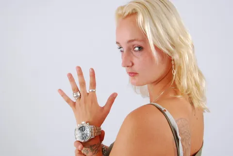 Tattooed Blonde Woman Undresses and Spreads Her Legs – photo 6 of 16