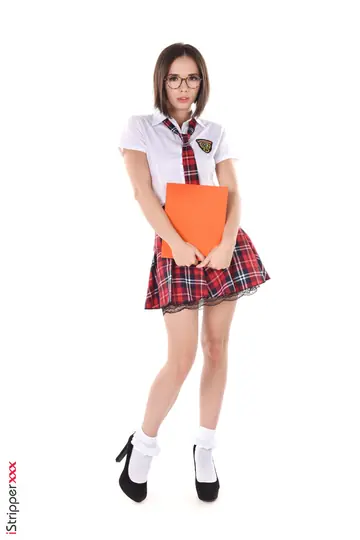 Busty Brunette in Uniform Skirt and Heels Plays with a Butt Plug