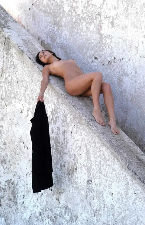Ainara: Brunette Lies Nude on a Stone Railing Outdoors – photo 5 of 18