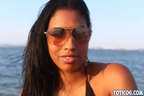 Thick Brunette Latina in a Bikini and Glasses Poses on the Beach – photo 12 of 15