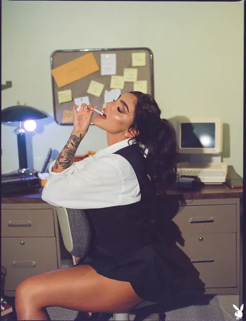 Emjay Rinaudo: Brunette in a Skirt and High Heels Flaunts Her Enhanced Tits and Tattoos – photo 1 of 20