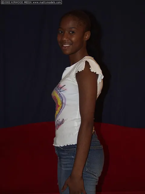 Ebony Babe Strips Out of Her Jeans and Shows Her Shaved Pussy – photo 1 of 16