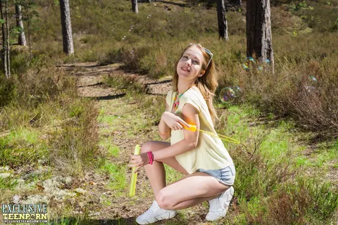 Thick Redhead Spreads Her Shaved Pussy in the Forest – photo 4 of 20