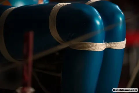 Woman Bound in Intricate Rope While Wearing a Latex Suit – photo 13 of 16
