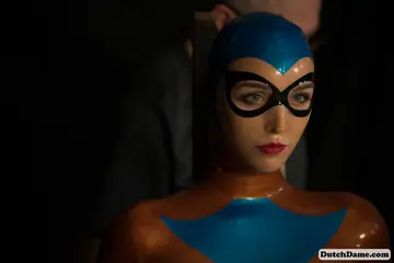 Woman Bound in Intricate Rope While Wearing a Latex Suit
