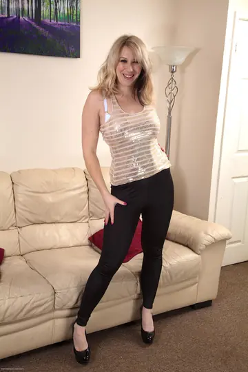 European Blonde MILF Fingers Her Hairy Pussy on the Sofa