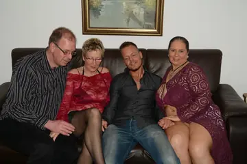 Angelika J – Mature European Blonde and Brunette Share a Blowjob in Group Sex