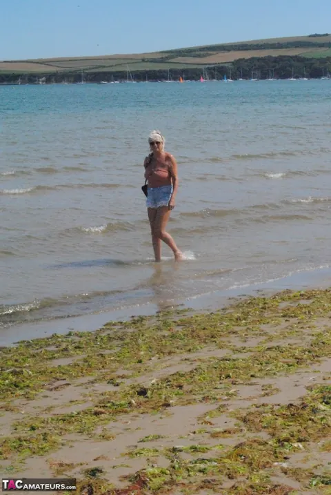 Slim Mature Blonde Strips Out of Her Shorts on the Beach – photo 6 of 20