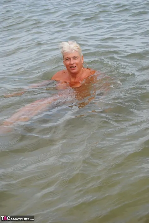 Slim Mature Blonde Strips Out of Her Shorts on the Beach – photo 17 of 20