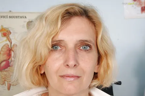 Mature Nurse Strips Out of Her Uniform and Spreads Her Legs – photo 4 of 16
