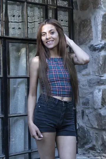 Slim Brunette Pulls Shorts Aside to Show Her Hairy Pussy Outdoors