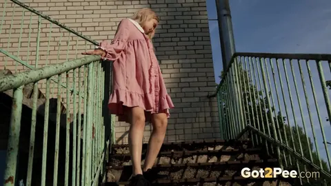 Blonde Pisses on Iron Stairs in Her Skirt – photo 3 of 15
