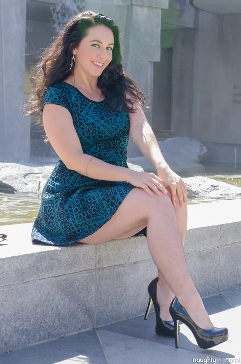 Nikki Silver: Busty Brunette in Glasses Poses in a Dress and Heels Outdoors – photo 7 of 20