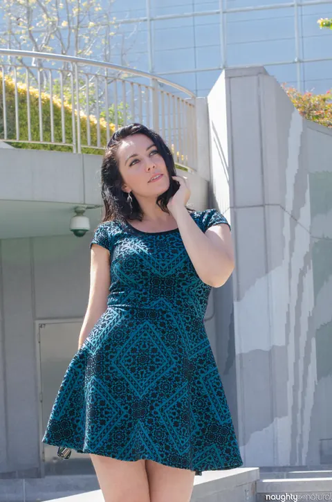Nikki Silver: Busty Brunette in Glasses Poses in a Dress and Heels Outdoors – photo 20 of 20