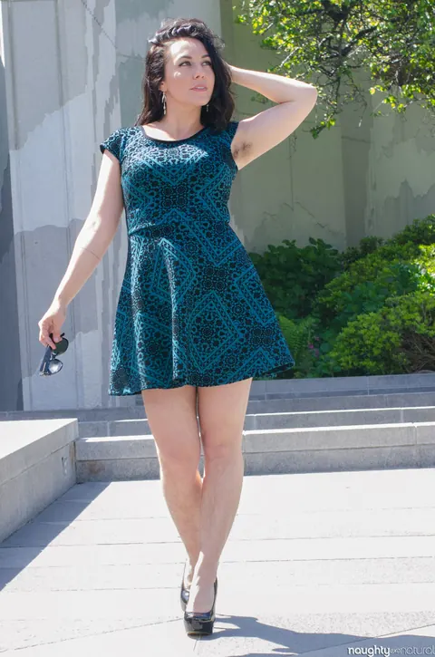 Nikki Silver: Busty Brunette in Glasses Poses in a Dress and Heels Outdoors – photo 19 of 20