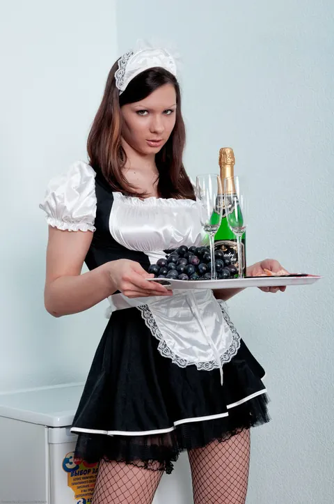 Woman Strips Out of Her Maid Uniform and Stockings – photo 1 of 21
