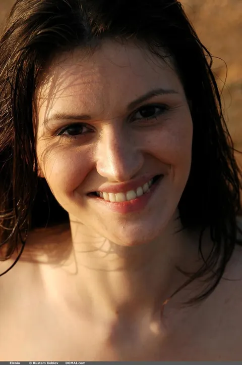 Elenia: Slim Mature Brunette Walks Nude on the Beach and Spreads – photo 13 of 17