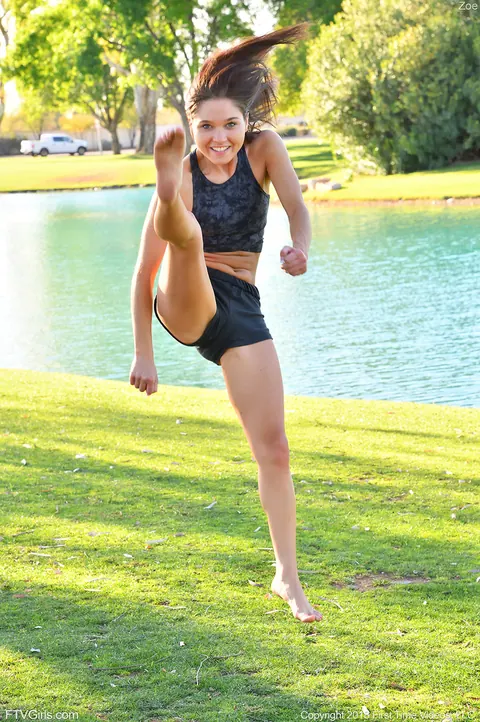 Zoe Bloom: Skinny Brunette Exercises Outdoors in Shorts by the Water – photo 15 of 20