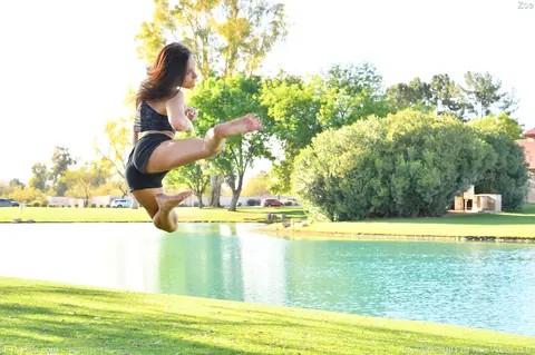 Zoe Bloom: Skinny Brunette Exercises Outdoors in Shorts by the Water – photo 6 of 20