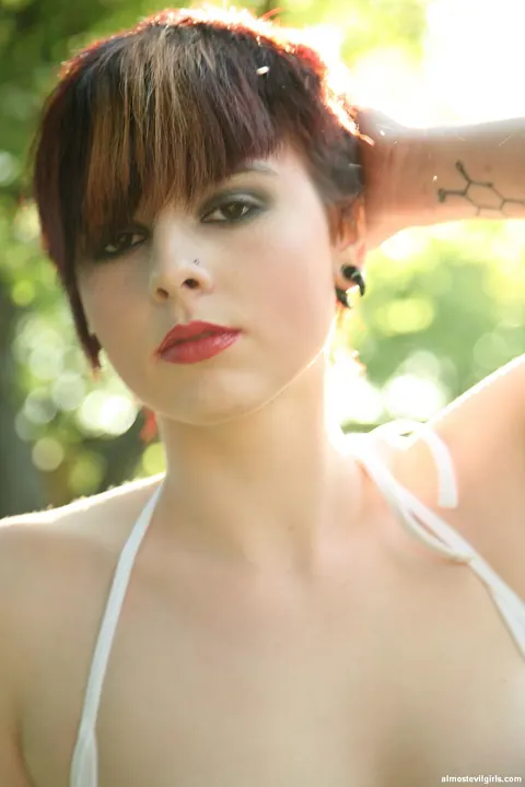 Short-Haired Redhead Spreads in a Bikini Outdoors – photo 14 of 15