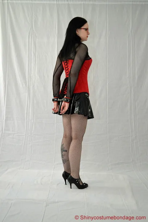 Bound Woman in a Latex Miniskirt, Pantyhose and Heels – photo 2 of 16