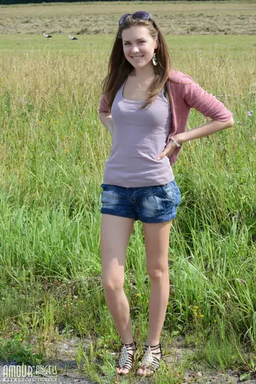 Rumba – Brunette Squats in Shorts and Spreads on Hay
