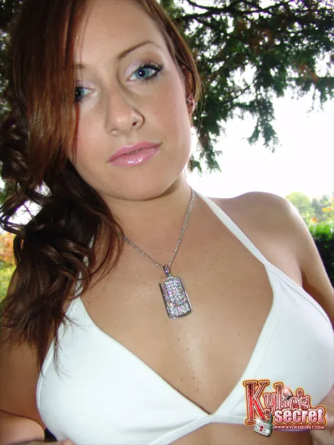 Brunette with a Piercing Lifts Her Skirt to Flash Thong Outdoors – photo 3 of 12