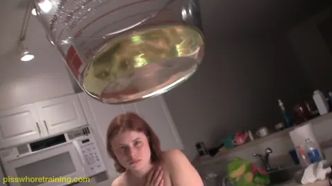 Redhead Fills a Measuring Cup with Piss in the Kitchen – photo 13 of 16