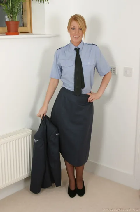 Woman with Enhanced Tits Strips Out of Her Uniform and Stockings – photo 11 of 21