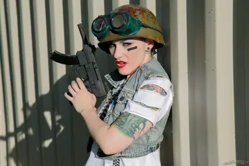 Shaved-Head Tattooed Brunette in Uniform Cosplay Gives a Blowjob and Anal