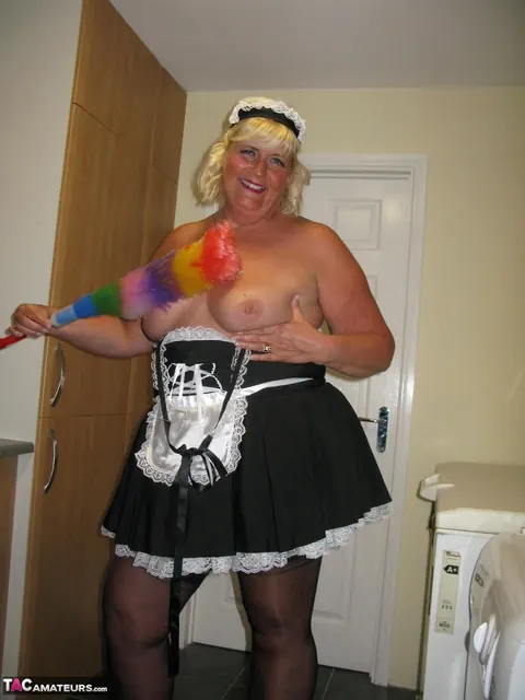 Curvy Mature Blonde Maid Strips Out of Her Uniform in the Kitchen – photo 13 of 20