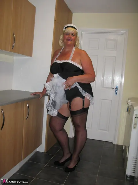 Curvy Mature Blonde Maid Strips Out of Her Uniform in the Kitchen – photo 4 of 20