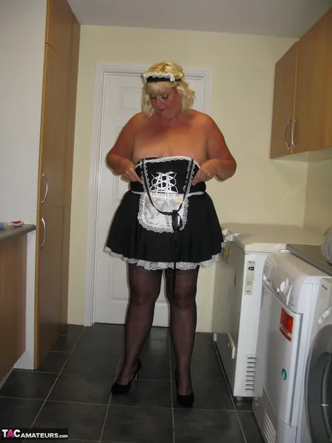 Curvy Mature Blonde Maid Strips Out of Her Uniform in the Kitchen – photo 11 of 20