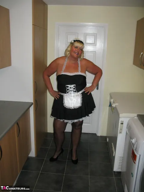 Curvy Mature Blonde Maid Strips Out of Her Uniform in the Kitchen – photo 1 of 20