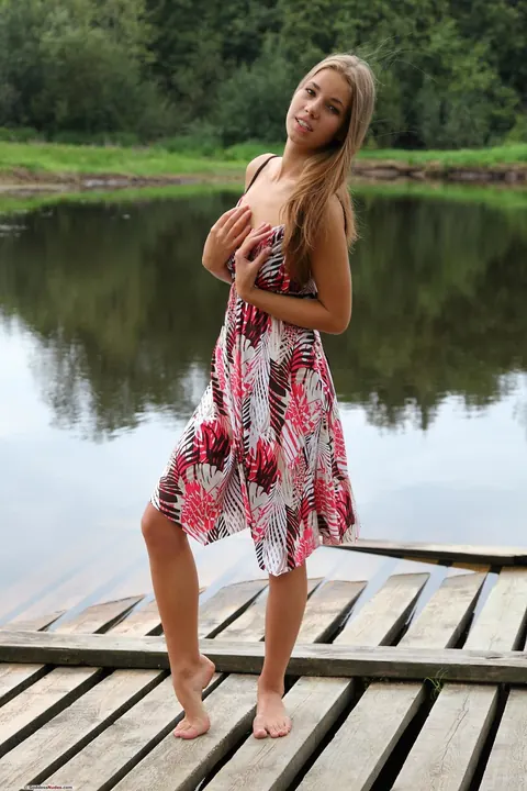 Woman Undresses and Spreads by the Dock – photo 3 of 20