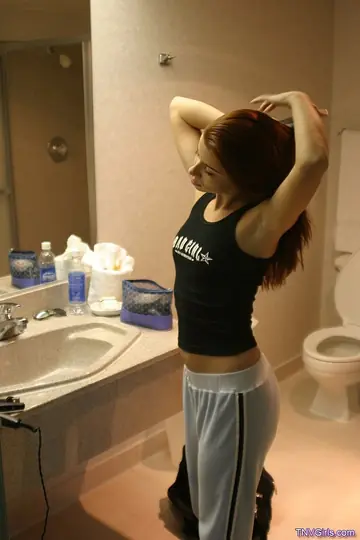 Busty Redhead Strips for a Shower with Her Partner