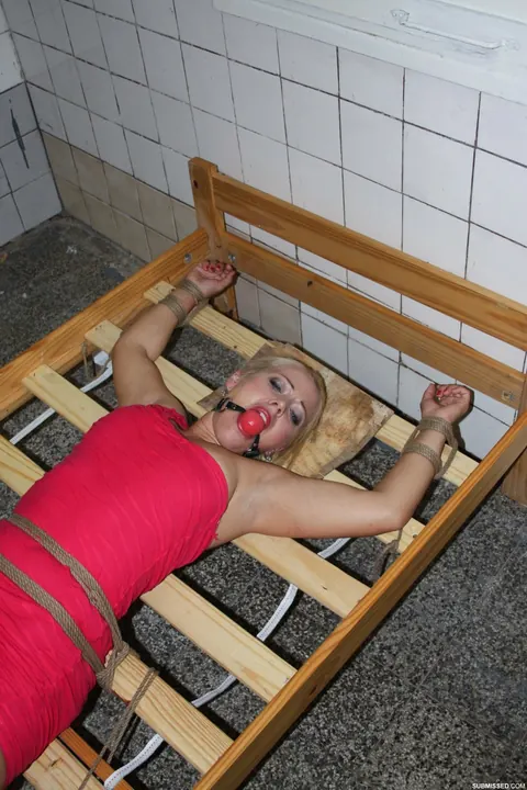 Blonde Woman Tied Up and Spreads Her Legs on a Bed – photo 15 of 17