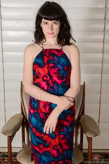 Thick Mature Brunette Pulls Panties Aside on the Chair