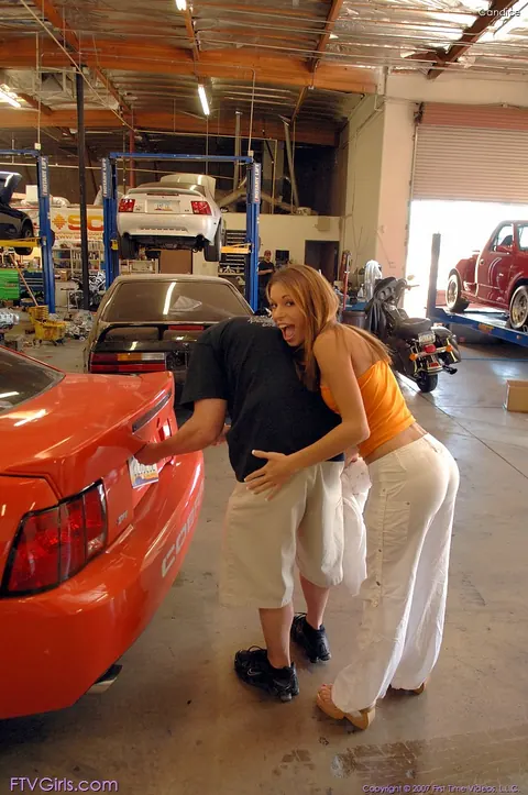 Cayton Caley: Brunette Strips Out of Her Panties in a Car Workshop – photo 5 of 20