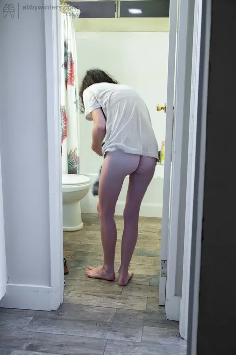 Pale Curly Brunette Spreads Her Hairy Pussy in the Bathroom – photo 12 of 16