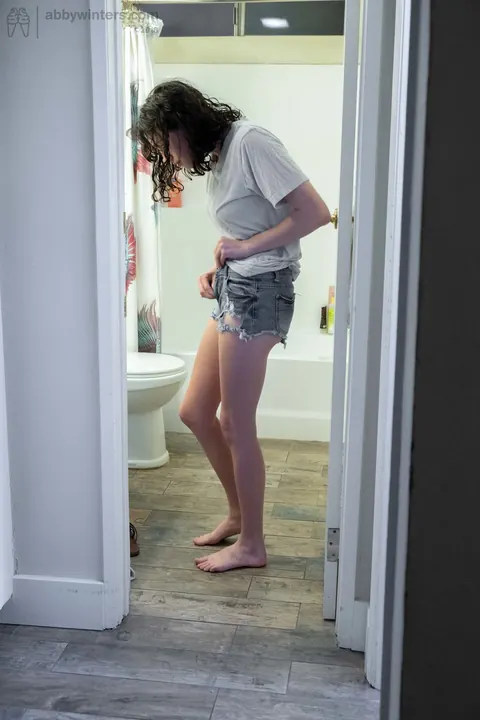 Pale Curly Brunette Spreads Her Hairy Pussy in the Bathroom – photo 14 of 16