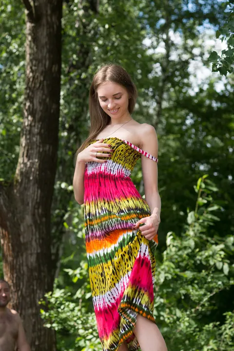 Slim Woman Strips Out of Her Dress Outdoors – photo 3 of 21