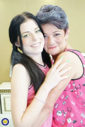 Short-Haired Mature Women Kiss, Lick Pussy and Share a Dildo