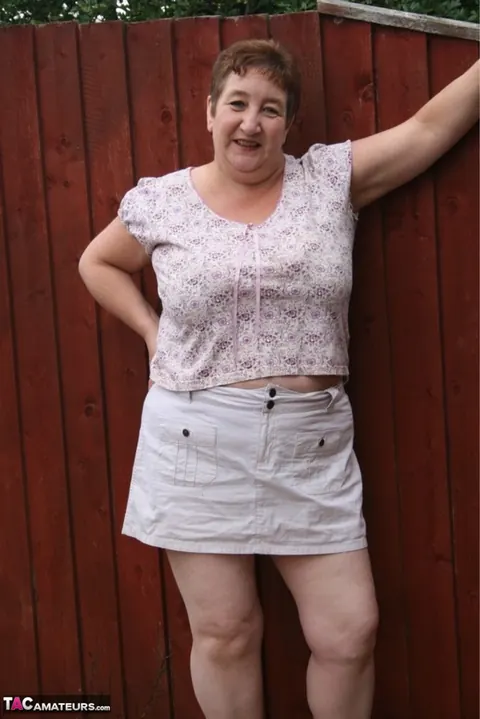 Kinky Carol: Mature British Redhead Undresses to Lingerie Outdoors – photo 1 of 16