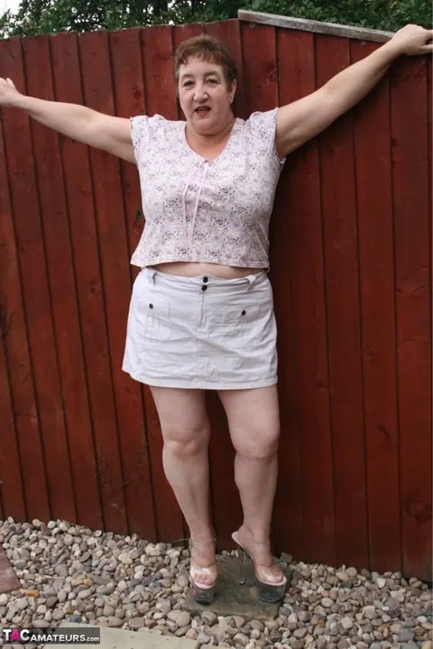 Kinky Carol: Mature British Redhead Undresses to Lingerie Outdoors – photo 2 of 16